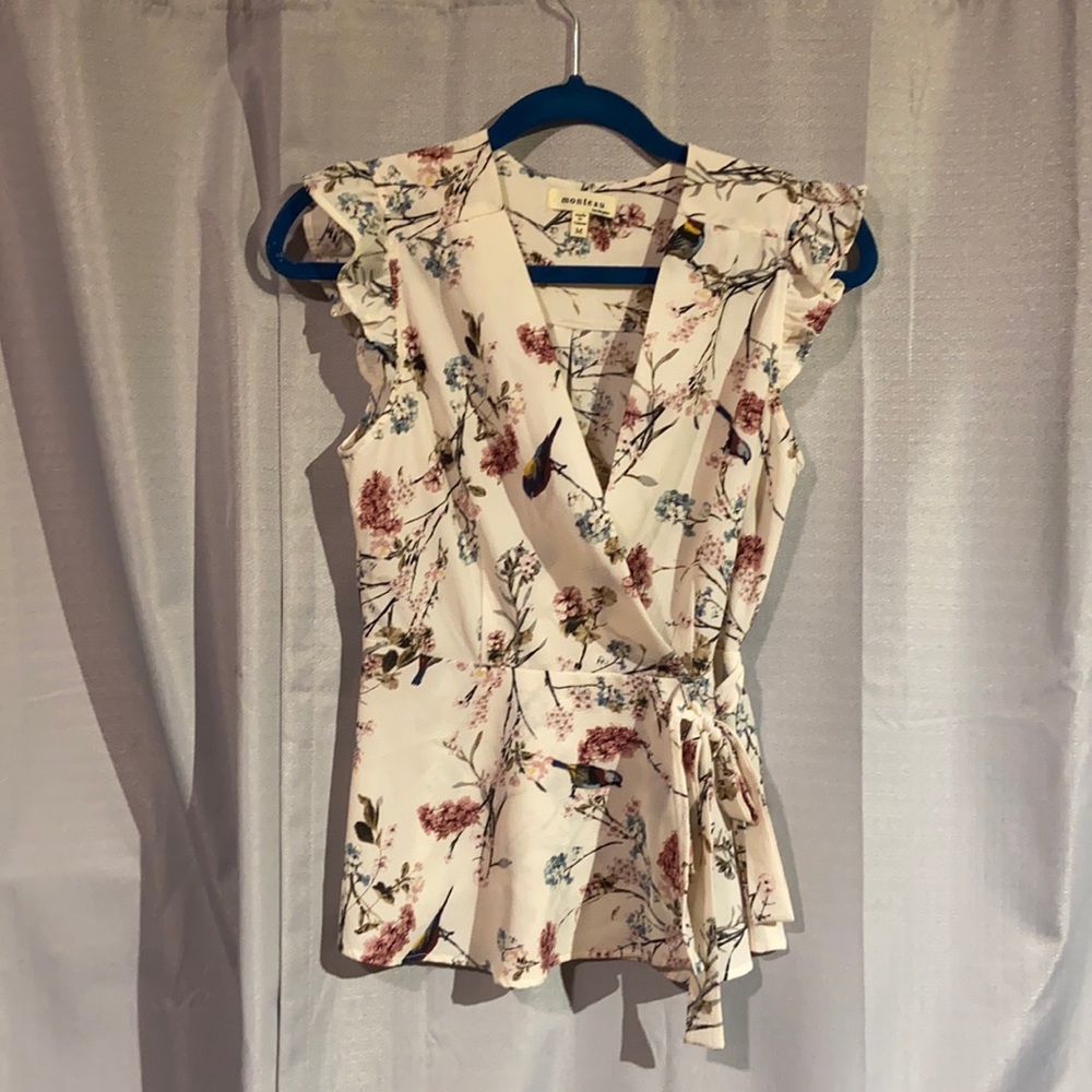 Medium peplum style top, gauze-like material, and fits very flattering.